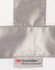 A reflective silver strip on a white fabric with a label for 3M Scotchlite reflective material.