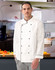 A unisex executive chef jacket in white with black trim, worn by a model in a kitchen setting.