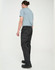 Lightweight nylon waterproof rain pants in black, modelled by a person wearing a blue T-shirt and black shoes.