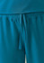 Teal women's jogger scrub pants featuring an elastic waistband and tie detail. The fabric appears soft and comfortable.