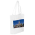 A white tote bag featuring a panoramic image of a church with a tall spire against a blue sky.