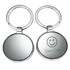 A silver keyring with a round design featuring a circular mirror surface and a logo.