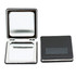 A compact mirror with a shiny interior and a black exterior. Features a logo on the front.
