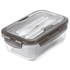 A clear lunch box with a grey lid, containing white utensils. Suitable for storing meals.