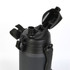 A drink bottle in matte black with a flip-top lid and a handle, featuring a logo.