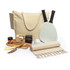 A picnic set featuring a beige tote bag, paddle bats, a ball, a cutting board, a knife, and a blanket.