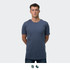 A plain navy blue men's t-shirt with a round neckline, worn by a model standing upright. Features a logo.