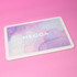 A jigsaw puzzle featuring soft pastel colours with a smooth surface. The puzzle has a logo on it.