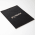 A black Velour DuPont A5 notebook with a textured cover and a logo on the front.
