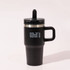 A drink bottle featuring a black exterior, double wall design, and a handle. It includes a logo on its surface.
