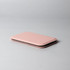 A pink pocket mirror with a slim, rectangular design, featuring a smooth surface and rounded edges.