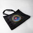 A black nylon mesh tote bag featuring a circular logo in the centre and two sturdy handles.