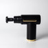 A black massage gun with gold accents, featuring an adjustable head and a sleek design. It has a logo on the side.