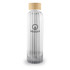 A drink bottle made of clear glass with a ribbed design and a natural wooden lid, featuring a logo.