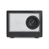 A black speaker with a transparent front and a visible speaker driver, featuring control buttons below.