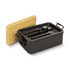 A black expandable lunch box with a bamboo lid, containing utensils: a spoon, fork, and knife.