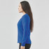 A blue long-sleeved women's tee displayed from the side, featuring a simple design and a logo.