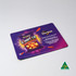 A mouse mat featuring a vibrant design with purple and orange colours, showcasing a snack bag and an Australian made emblem.
