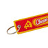 A red and yellow woven keytag featuring a cheese slice design and a round keyring attachment.