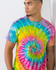 A vibrant tie-dye adult T-shirt featuring a swirl of pink, blue, yellow, and green colours, worn by a model.