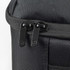 A black travel backpack featuring dual zippers and a textured fabric surface. It has a logo on the side.