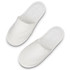 A pair of white waffle slippers with a textured surface and a soft, plush interior.