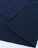 A close-up of a navy blue polo shirt displaying its fabric and hem details. The shirt has a logo.