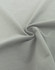A close-up of a soft, grey fabric in a spiral formation, showcasing its smooth texture.
