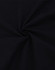 A dark black oversized tee made from heavy cotton, featuring a smooth, twisted fabric texture.