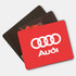 A set of three mouse mats in various colours, including a red one with a logo and two in darker tones.