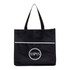 A black shopping tote bag featuring a textured upper and a circular logo at the centre.