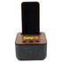 A Bluetooth speaker with a wooden top, grey fabric base, and a slot for a phone. It features buttons on the front and has a logo.