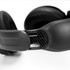 Black wireless headphones with cushioned ear cups and a sleek design, featuring a textured adjustable headband.