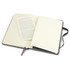 A large black Moleskine Classic Hard Cover Notebook, open to reveal cream pages and a blank insert.