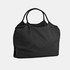A black nylon shopper bag with two handles and a soft, crumpled texture. It features a logo on the side.