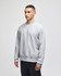 A grey Champion Reverse Weave® adult crew sweatshirt on a model, featuring a branding logo on the sleeve.