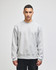 A grey Champion Reverse Weave® adult crew sweatshirt with long sleeves and a logo on the sleeve.