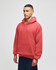A red crewneck sweatshirt with a hood, featuring a front pocket and a logo on the sleeve.