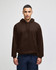 A brown pullover hooded sweatshirt with a front pocket and loose fit, featuring a logo on the chest area.