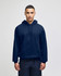 A navy blue pullover hooded sweatshirt with a front pocket and a logo. The model is wearing it against a plain background.