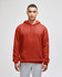 A red pullover hooded sweatshirt with a front pocket, modelled by a person wearing grey pants. The sweatshirt has branding.