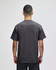 A grey Champion adult short-sleeve t-shirt showcasing the back view, featuring a logo.