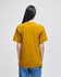 A mustard yellow short-sleeve t-shirt viewed from the back, featuring a simple design and a logo.