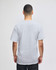 A grey Champion adult short-sleeve t-shirt displayed from the back, featuring a logo.