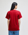A red Champion adult short-sleeve t-shirt from the back, featuring a simple design and a straight cut.