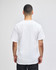 A man wearing a plain white short-sleeve t-shirt, viewed from the back, with a logo on the shirt.