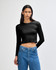 A black long-sleeve crop fitted t-shirt on a model, paired with blue jeans. The shirt features a logo.