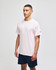 A pink Champion adult jersey short sleeve t-shirt displayed on a model, paired with navy shorts. The shirt features a branding logo.