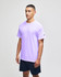 A lavender short sleeve t-shirt with a logo on the sleeve, paired with navy shorts.