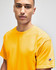 A yellow short sleeve t-shirt featuring a logo on the sleeve, worn by a model.